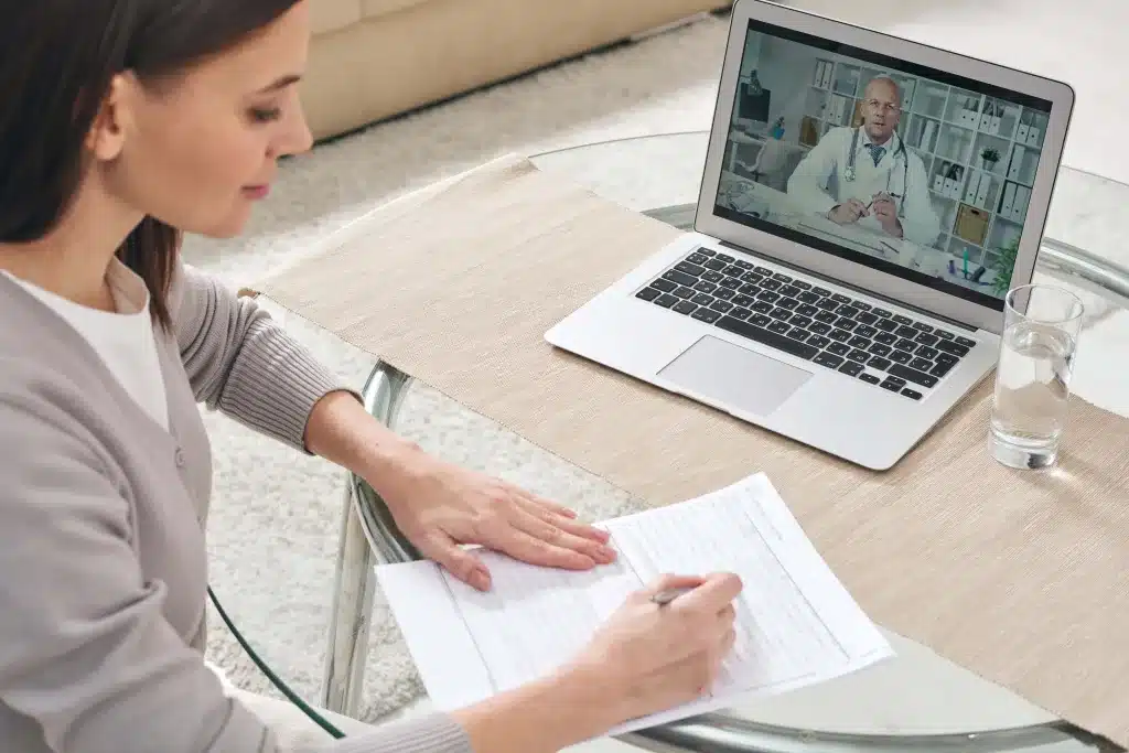 Woman at home on a telemedicine appointment with her doctor